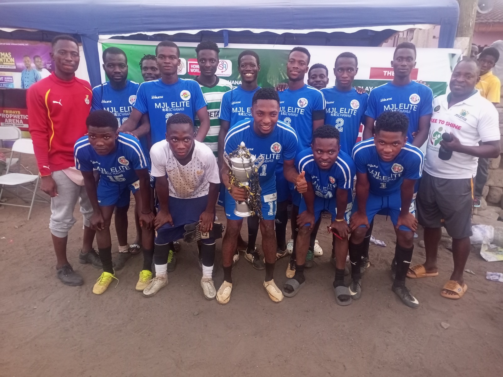 Street soccer team pose with their trophy