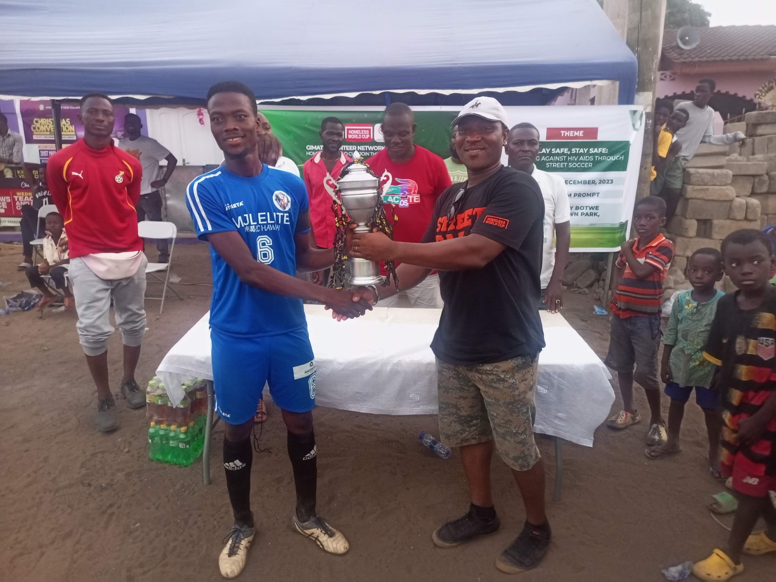 Trophy presentation at a GVN street soccer tournament